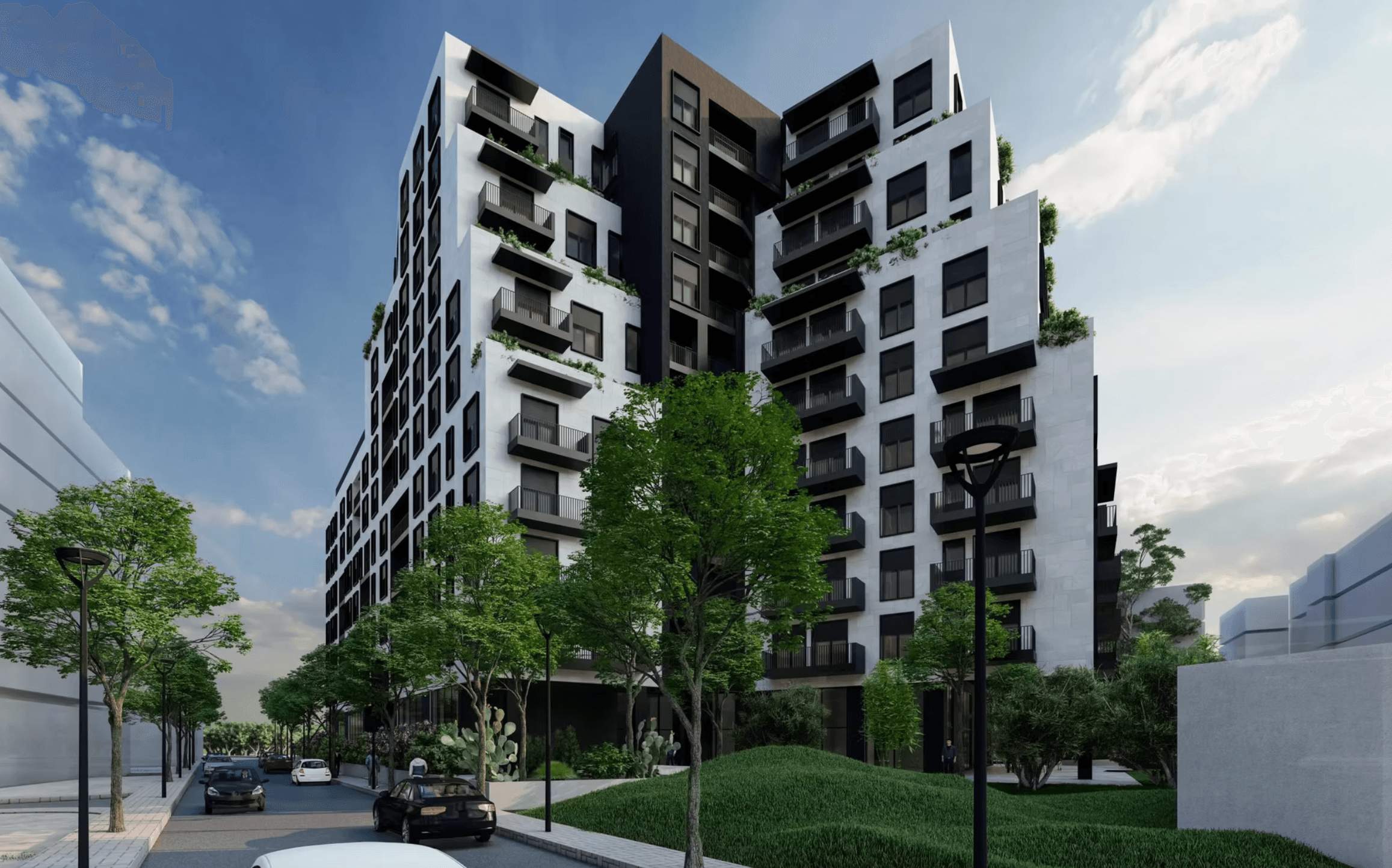 Modern black and white apartment building with balconies and greenery along a tree-lined street.